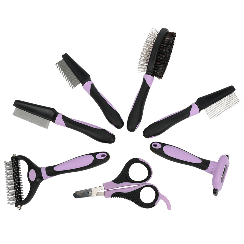 Purple-and-black pet grooming kit showing the supplied tool assortment